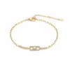 pulseira dourada com cristal retangular em fundo branco, referencia 85251-01