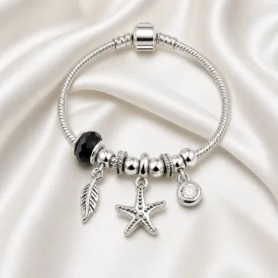 pulseira prateada com conta preta em cetim marfim, referencia 85326-3