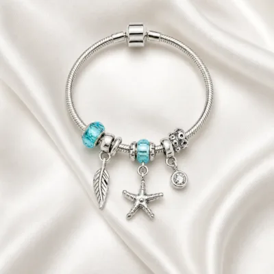 pulseira prateada turquesa em cetim marfim, referencia 85326-3