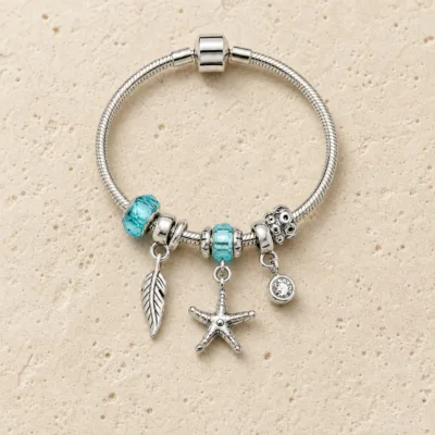 pulseira prateada turquesa em pedra clara de tom quente, referencia 85326-3