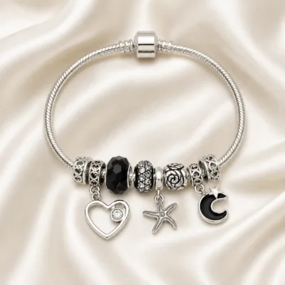 pulseira prateada com conta preta em cetim marfim, referencia 85326-4