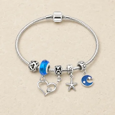 pulseira prateada azul em pedra clara de tom quente, referencia 85326-4