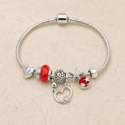 pulseira prateada vermelha em pedra clara de tom quente, referencia 85326-4
