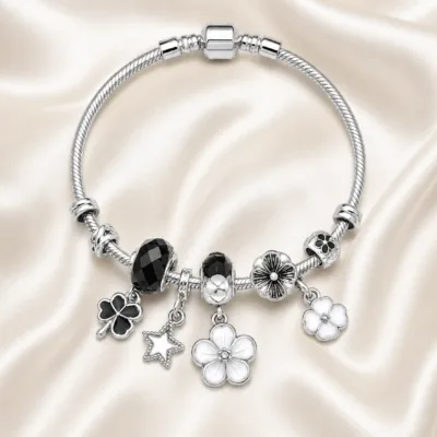 pulseira prateada com conta preta em cetim marfim, referencia 85327-1