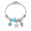 pulseira prateada azul-turquesa em fundo branco, referencia 85327-1