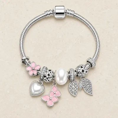 pulseira prateada rosa com pérola em pedra clara de tom quente, referencia 85327-2