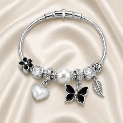 pulseira prateada preta com pérola em cetim marfim, referencia 85327-2