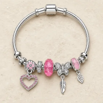 pulseira prateada rosa com coração em pedra clara de tom quente, referencia 85327-3
