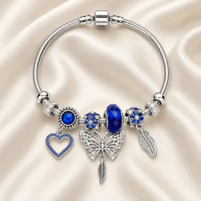 pulseira prateada azul com coração em cetim marfim, referencia 85327-3
