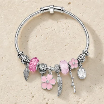 pulseira prateada rosa com flores em pedra clara de tom quente, referencia 85327-4