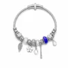 pulseira prateada transparente com conta azul em fundo branco, referencia 85327-4