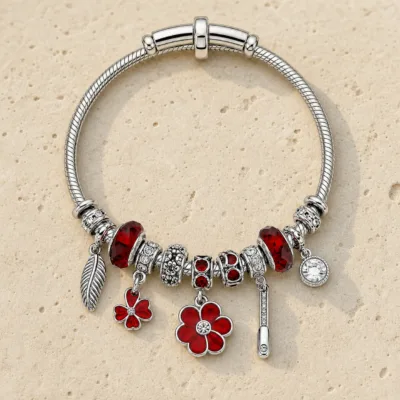 pulseira prateada vermelha com flores em pedra clara de tom quente, referencia 85327-4