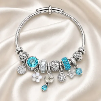 pulseira prateada turquesa com cristais em cetim marfim, referencia 85327-5