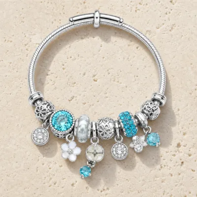 pulseira prateada turquesa com cristais em pedra clara de tom quente, referencia 85327-5