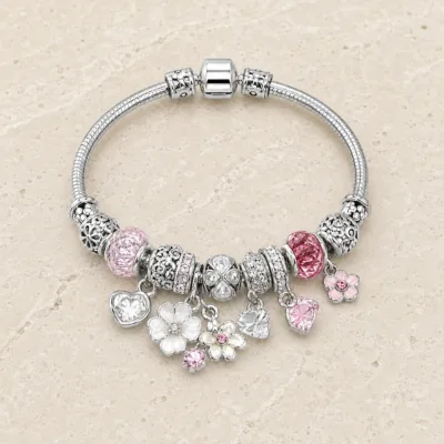 pulseira prateada rosa com flores em pedra clara de tom quente, referencia 85327-5