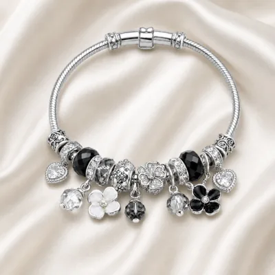 pulseira prateada preta com flores em cetim marfim, referencia 85327-5