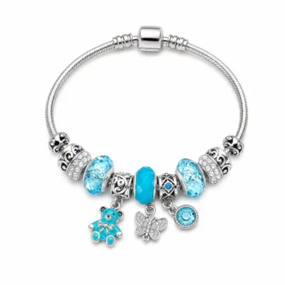 pulseira prateada turquesa com urso em fundo branco, referencia 85327-6