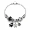 pulseira prateada preta com urso em fundo branco, referencia 85327-6