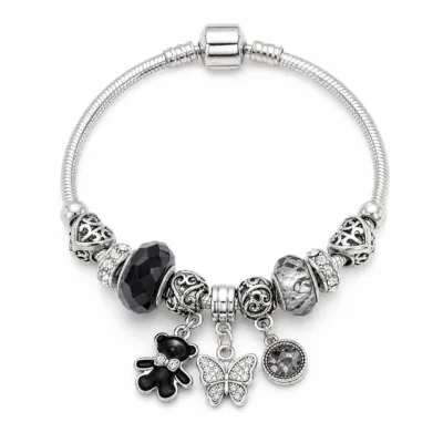 pulseira prateada preta com urso em fundo branco, referencia 85327-6