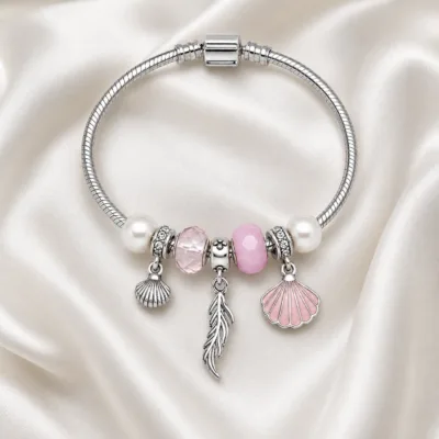 pulseira prateada rosa com conchas em cetim marfim, referencia 85328-1