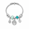 pulseira prateada turquesa árvore da vida em fundo branco, referencia 85328-10