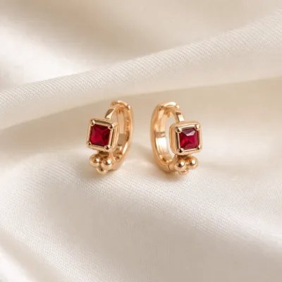 Brincos dourados rosa modelo C com cristal quadrado azul