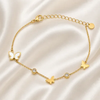 pulseira dourada com borboletas e cristais em cetim marfim, referência 85382-2