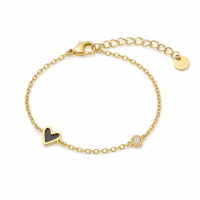 pulseira dourada com coração preto e cristal em fundo branco, referência 85382-3