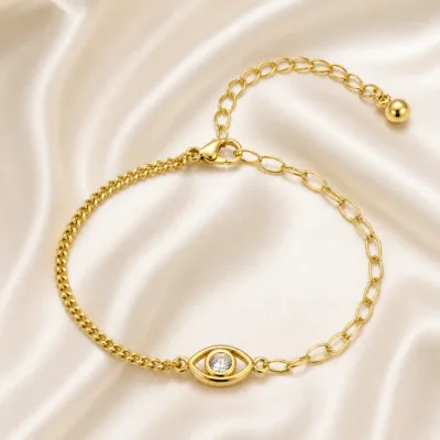 pulseira dourada olho protetor com cristal em cetim marfim, referência 85383-1