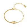 pulseira dourada olho protetor com cristal em fundo branco, referência 85383-1