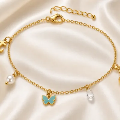 pulseira dourada com pendentes coloridos em cetim marfim, referência 85384-2