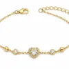 pulseira dourada com coração de cristal e halo em fundo branco, referência 85384-5