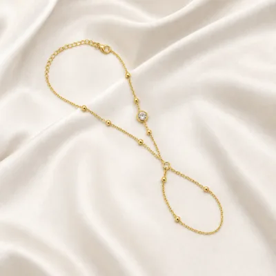 pulseira de mão dourada com cristal e anel em cetim marfim, referência 85384-6
