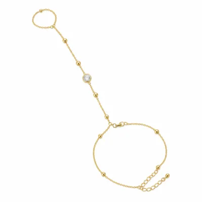 pulseira de mão dourada com cristal e anel em fundo branco, referência 85384-6