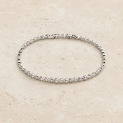 pulseira prateada com zircões em pedra clara de tom quente, referencia 85394-1