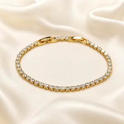 pulseira dourada riviera com zircões em cetim marfim, referencia 85399-1