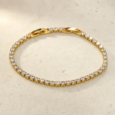 pulseira dourada riviera com zircões em pedra clara de tom quente, referencia 85399-1