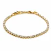 pulseira dourada riviera com zircões em fundo branco, referencia 85399-1