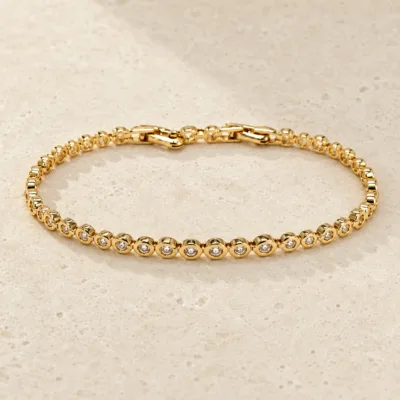 pulseira dourada com elos e zircões em pedra clara de tom quente, referencia 85400-1