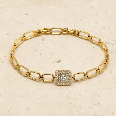 pulseira dourada com cristal quadrado em pedra clara de tom quente, referencia 85401-1