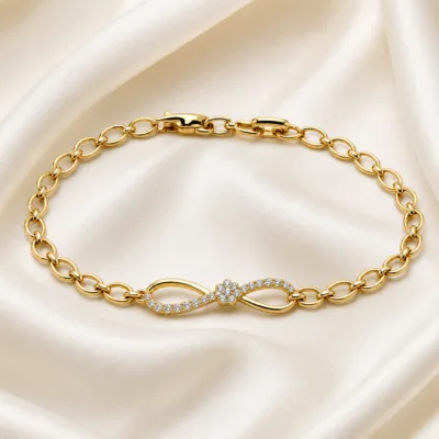 pulseira dourada infinito com zircões em cetim marfim, referencia 85401-2