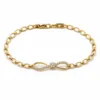 pulseira dourada infinito com zircões em fundo branco, referencia 85401-2