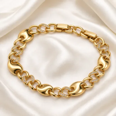 pulseira dourada com elos esculturais em cetim marfim, referencia 85402-3