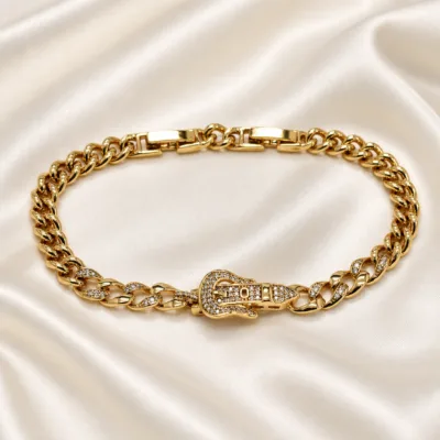 pulseira dourada cubana com mão de zircões em cetim marfim, referencia 85403-2