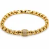 pulseira dourada com cilindro de zircões em fundo branco, referencia 85403-3