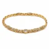 pulseira dourada com cinco olhos de zircões em fundo branco, referencia 85404-2