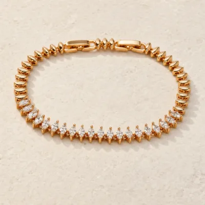 pulseira ouro rosa com cristais navette em pedra clara de tom quente, referencia 85406-1