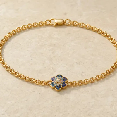 pulseira dourada com cristais azuis, Flor Azul de Seis Pétalas, em pedra clara de tom quente, referencia 85407-1,2