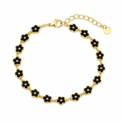 Pulseira dourada de flores pretas, uma pulseira, vista em fundo branco