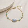 Pulseira Dourada com Pedra Azul, referência 85439-2-D